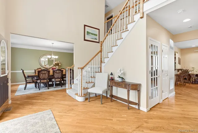 a view of dining room with furniture and a chandelier