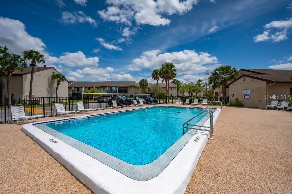 2611 Pine Lake Terrace, Unit B Sarasota, FL 34237 - Photo 17 of 21 a view of swimming pool with outdoor seating and yard