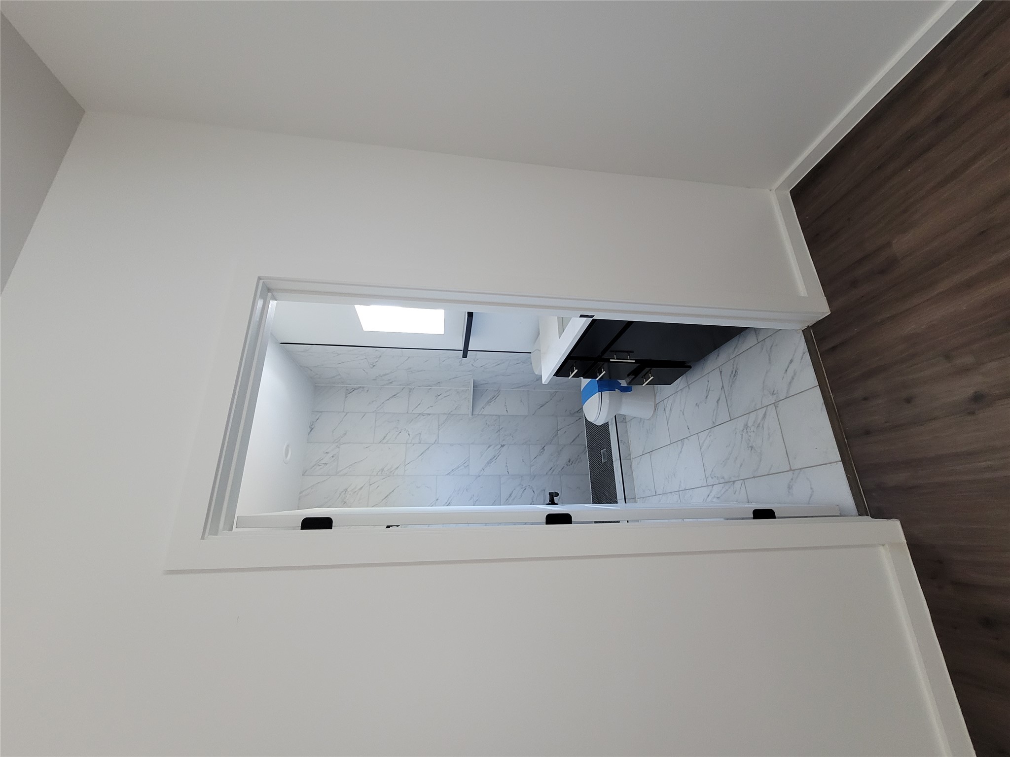 422 A Road Stockdale, TX 78160 - Photo 28 of 40 Step into a new primary bathroom featuring sleek tile and a functional vanity.