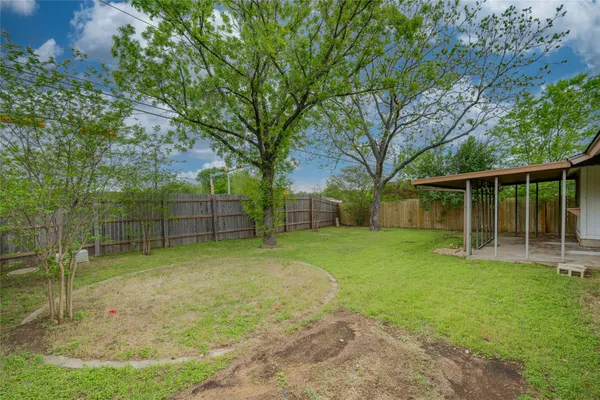 a backyard of a house with entertaining space