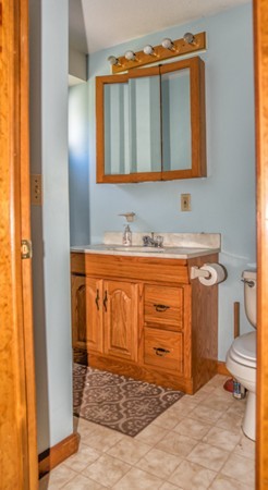 38 Bourne Street Three Rivers, MA 01080 - Photo 11 of 30 a bathroom with a sink a vanity and a mirror