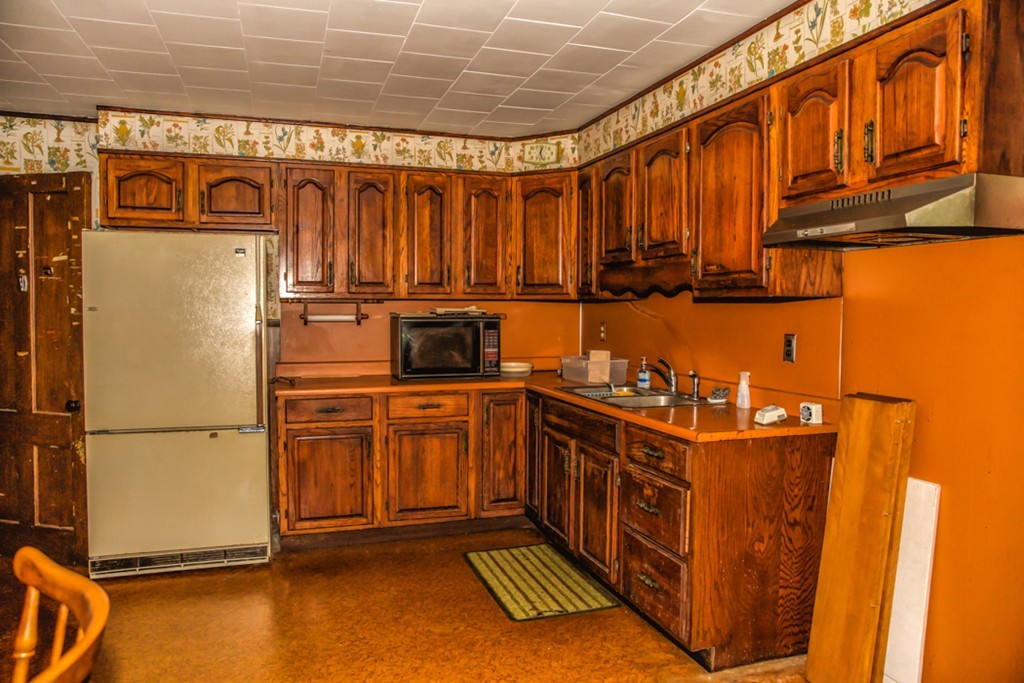 38 Bourne Street Three Rivers, MA 01080 - Photo 5 of 30 a kitchen with stainless steel appliances granite countertop a refrigerator a stove and a sink