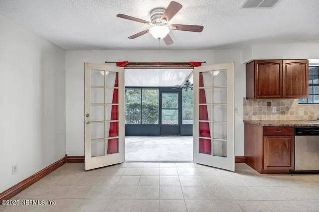 a view of kitchen with a sink and a fireplace