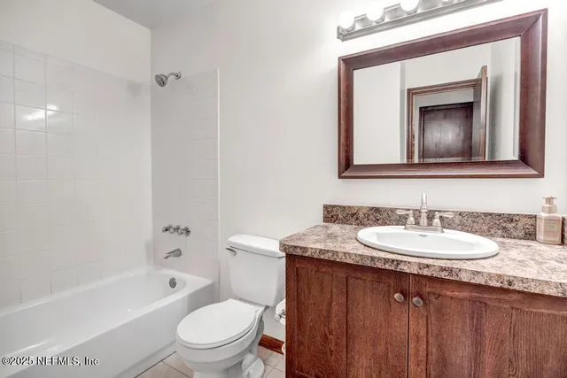 a view of an empty room with a large window