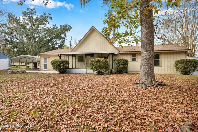a wooden bench with view of trees