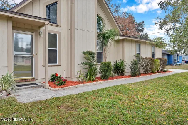 a front view of a house with garden