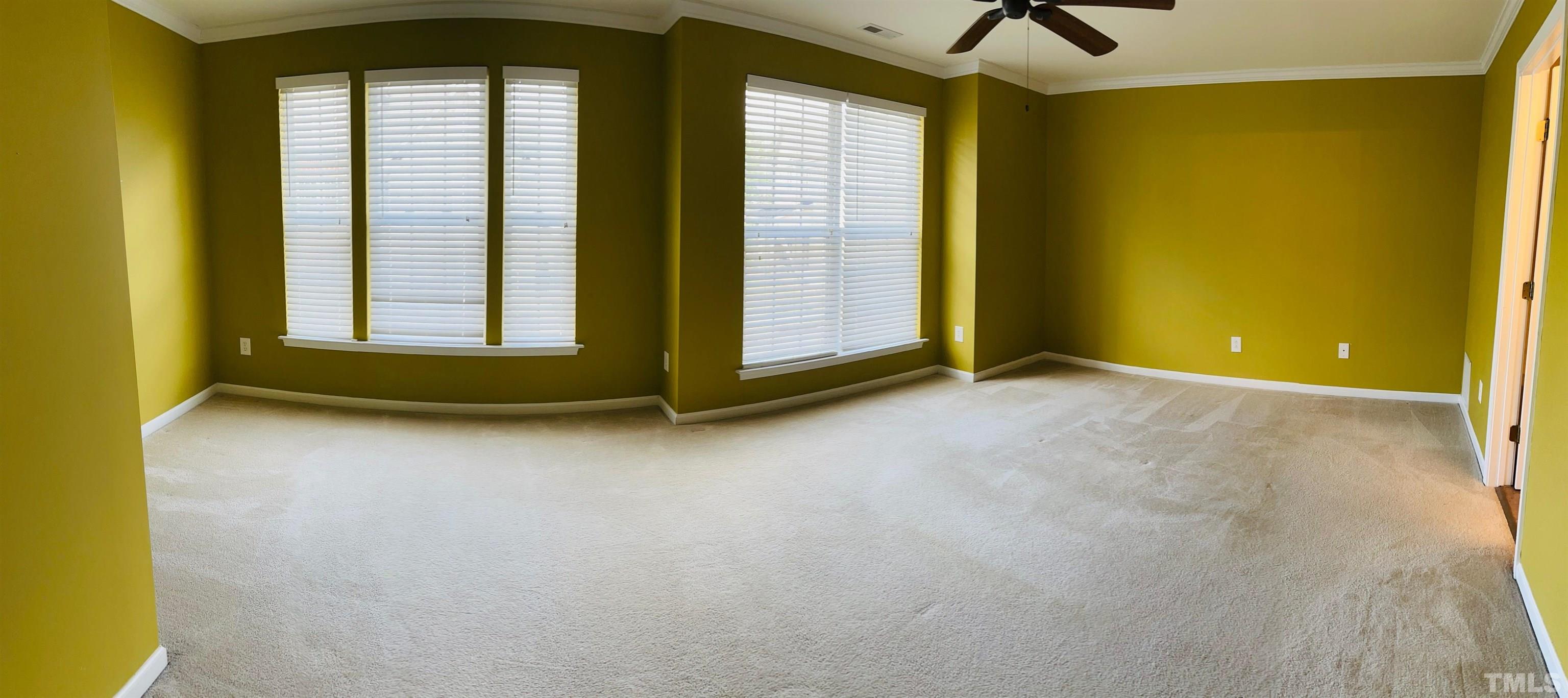 9817 Grettle Court Raleigh, NC 27617 - Photo 11 of 15 a view of an empty room with a window