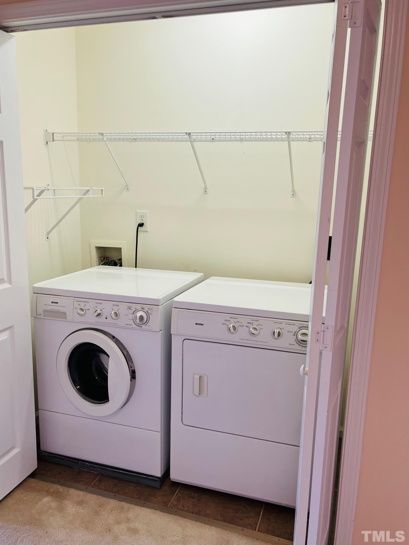 9817 Grettle Court Raleigh, NC 27617 - Photo 12 of 15 a utility room with dryer and washer