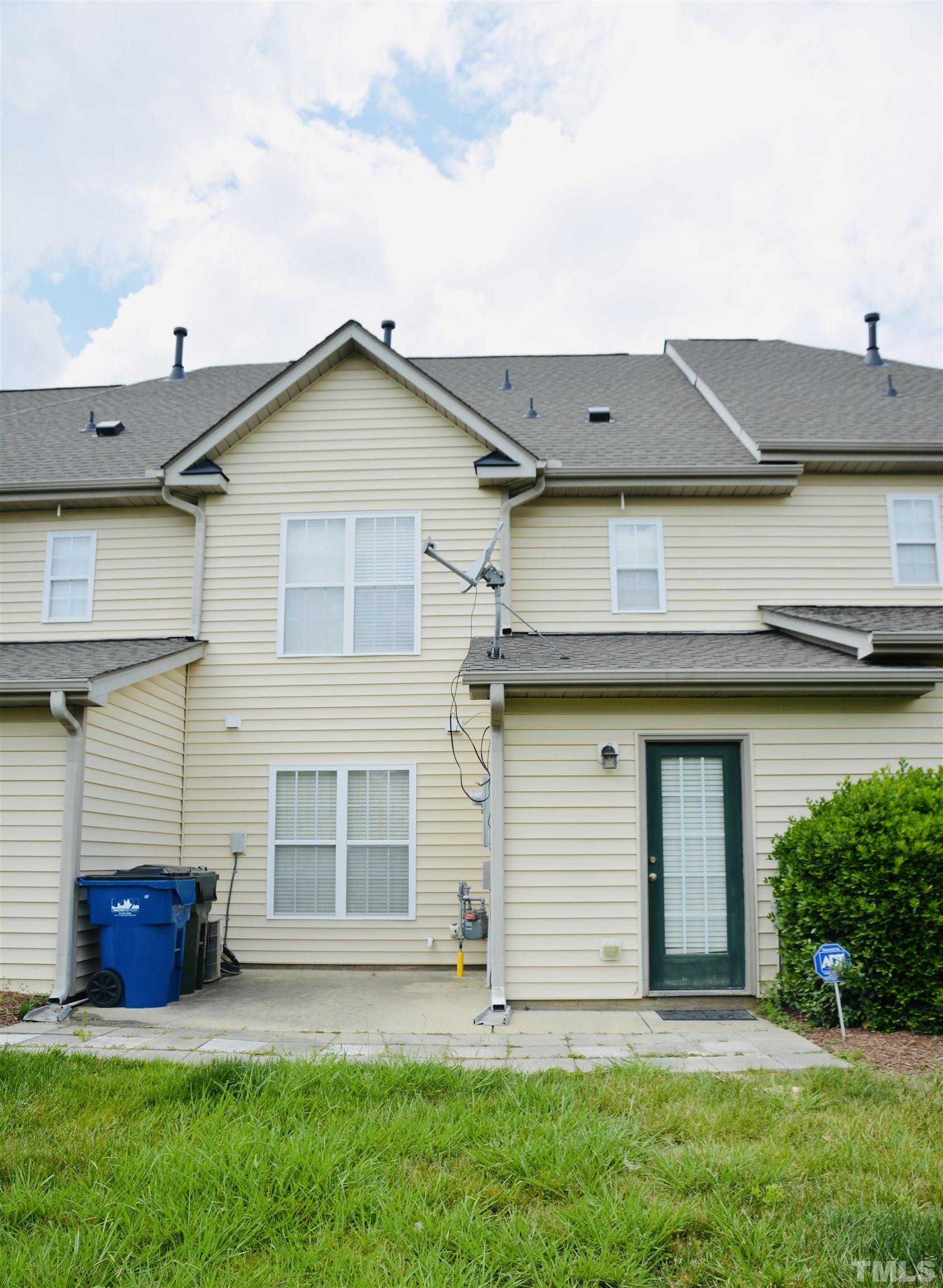 9817 Grettle Court Raleigh, NC 27617 - Photo 2 of 15 front view of a house with a yard