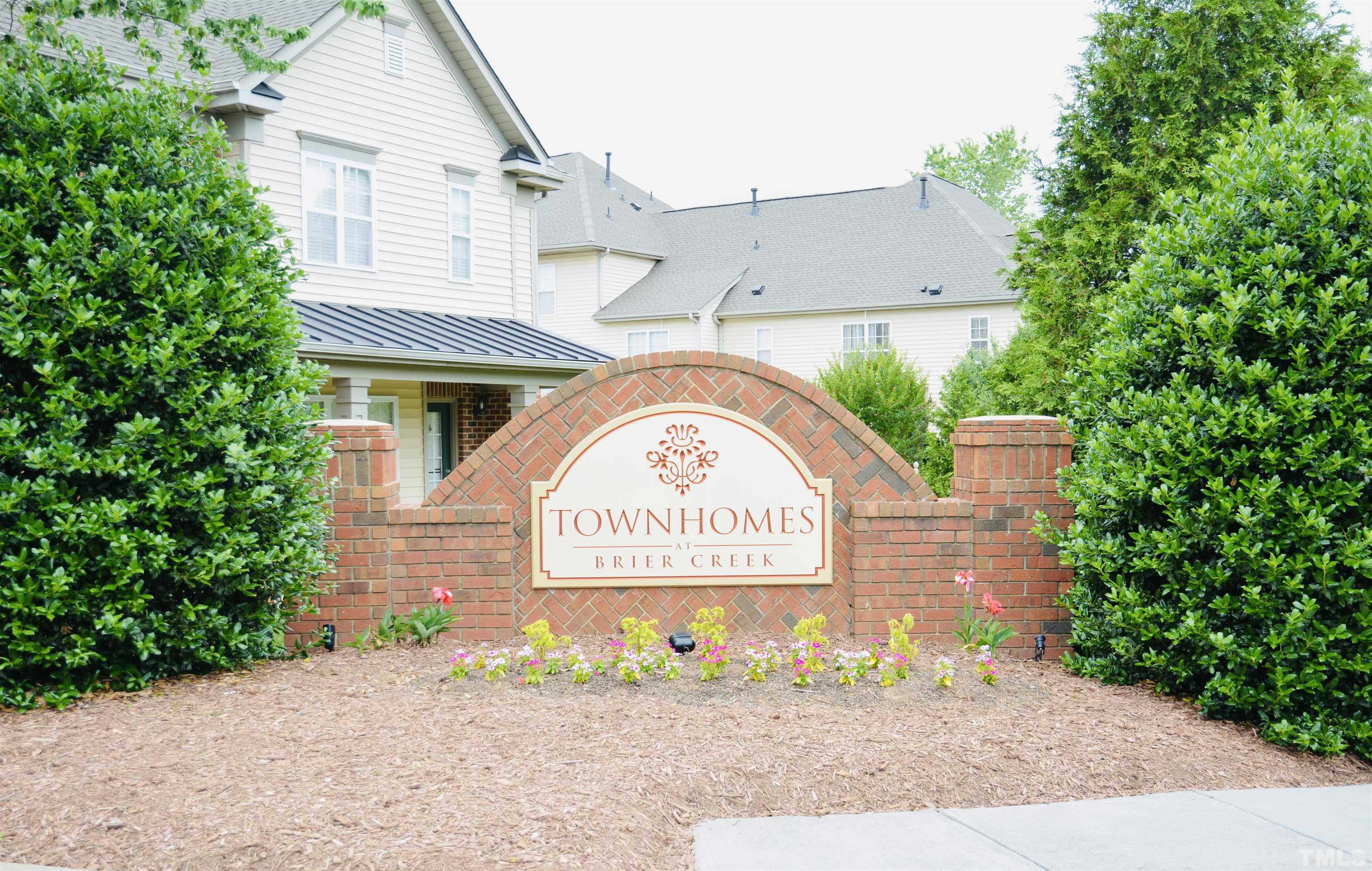 9817 Grettle Court Raleigh, NC 27617 - Photo 4 of 15 a sign on the side of a building