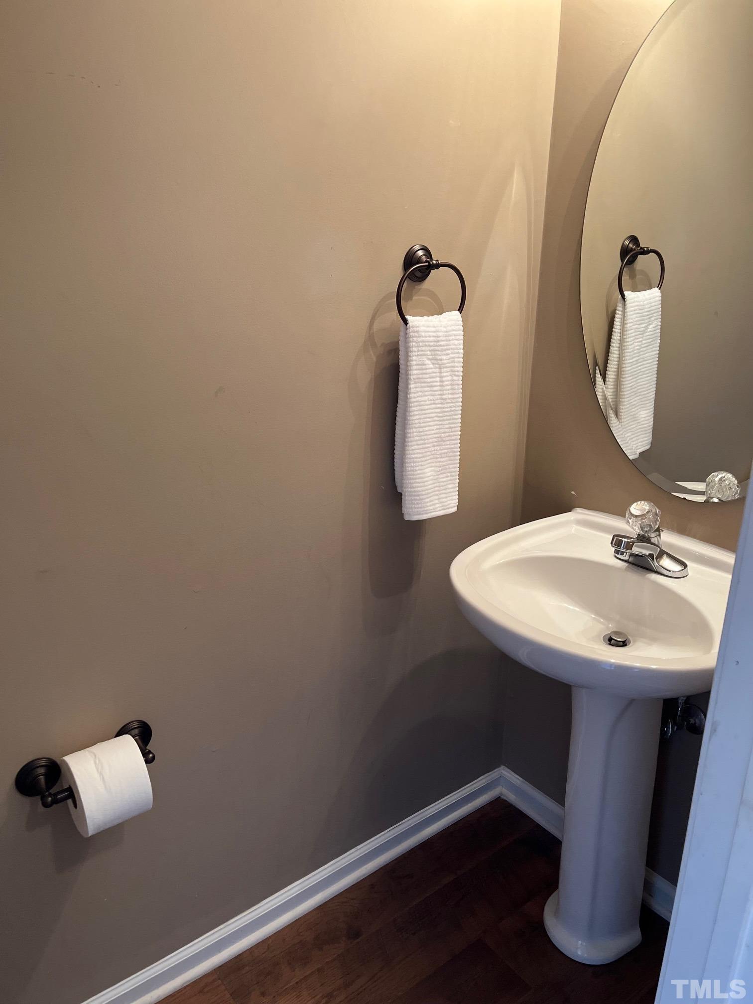9817 Grettle Court Raleigh, NC 27617 - Photo 6 of 15 a bathroom with a sink and mirror