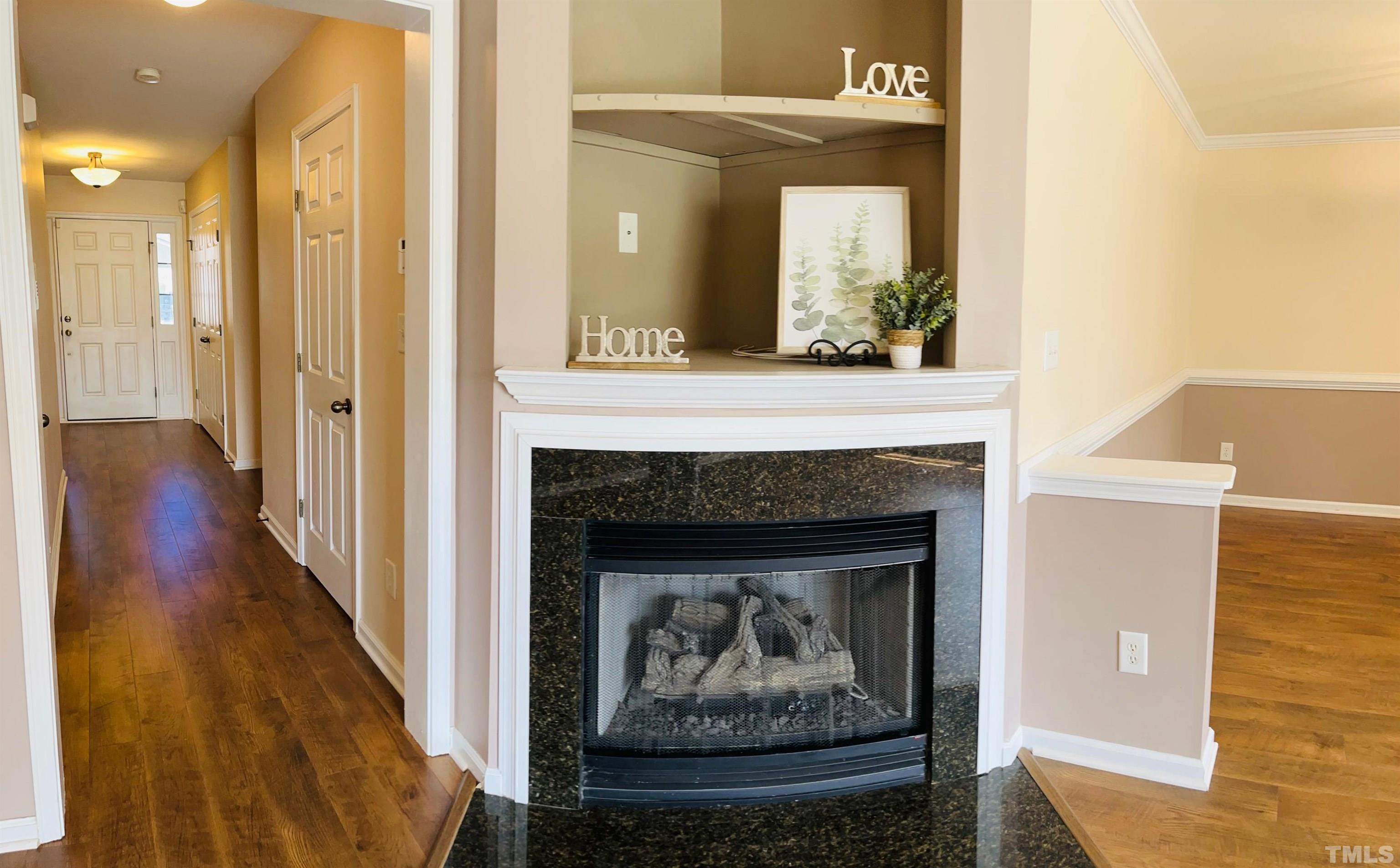 9817 Grettle Court Raleigh, NC 27617 - Photo 7 of 15 a living room with furniture and a fireplace