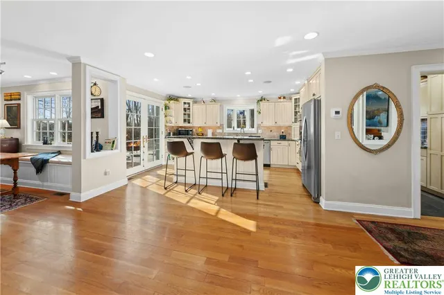 a view of a living room and kitchen with a large window