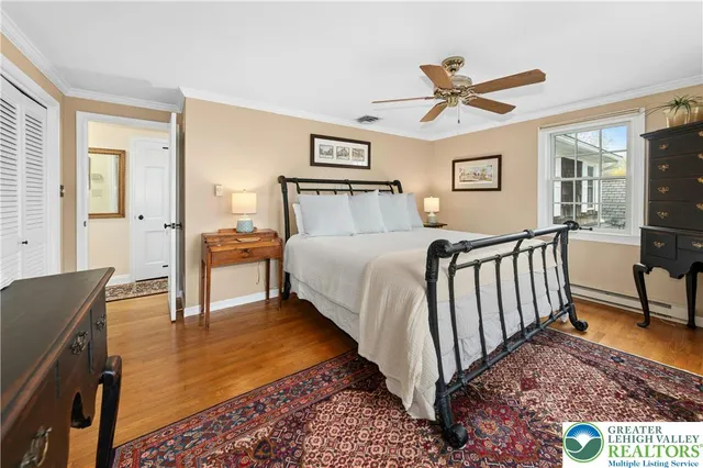 a bed room with a bed and a chandelier