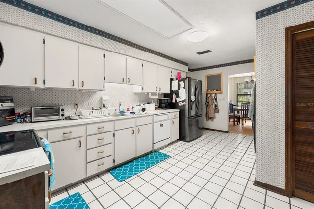 a kitchen with a cabinets and appliances