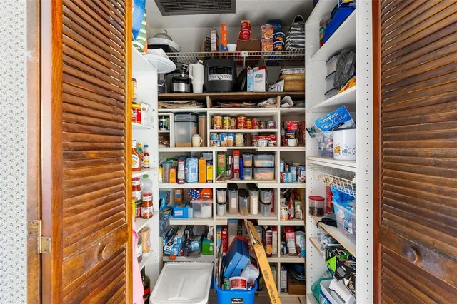 a room with books and a book shelf