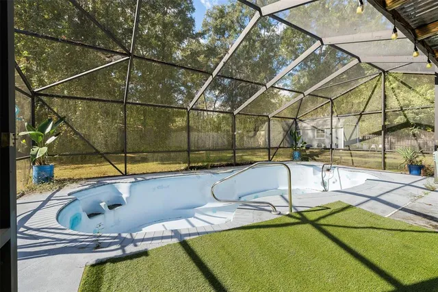 a view of a house with yard and sitting area