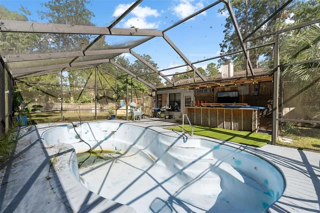 a view of a swimming pool with a patio
