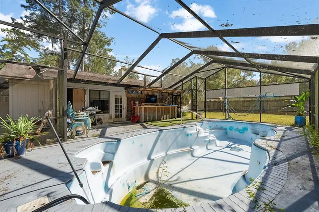a view of a swimming pool with a patio