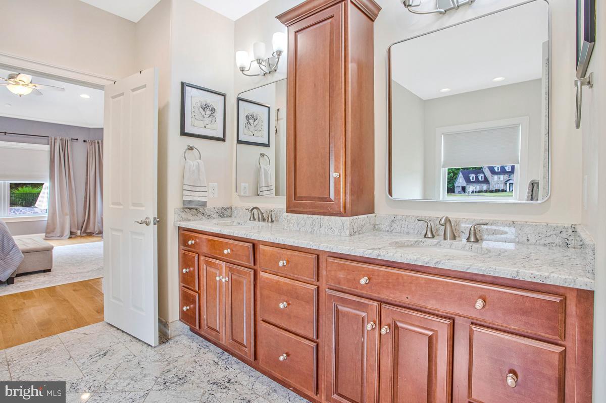 5 Jessie Road Harwood, MD 20776 - Photo 40 of 87 a bathroom with a granite countertop double vanity sink and a mirror