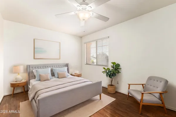 a bedroom with a bed and window