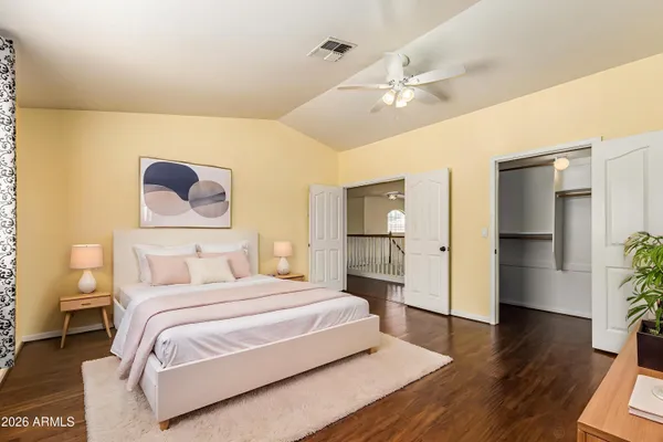 a bedroom with a bed and a walk in closet