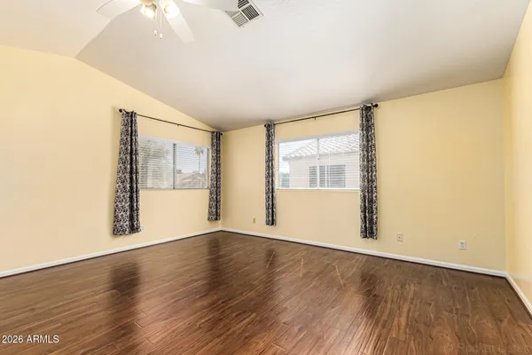 a view of walk in closet with empty racks