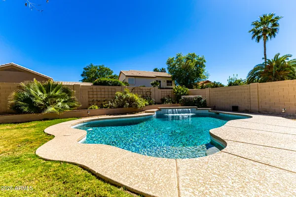 a view of a swimming pool with a patio