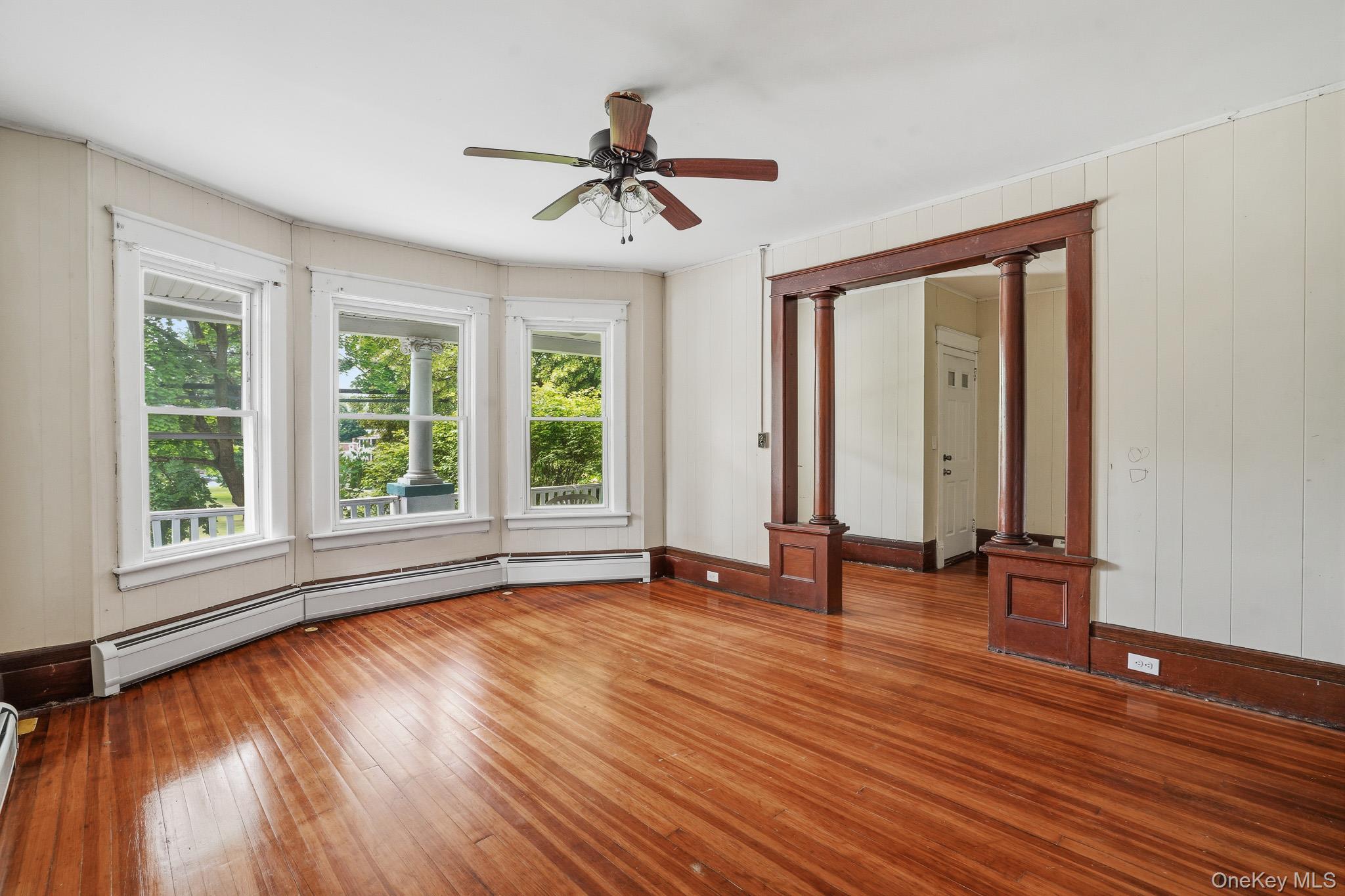 65 North Clinton Street Poughkeepsie, NY 12601 - Photo 8 of 43 a view of an empty room with wooden floor and a window