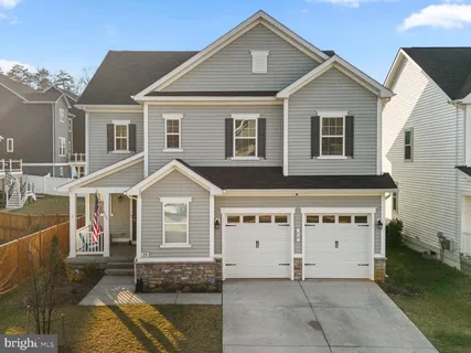 a front view of a house with a garage