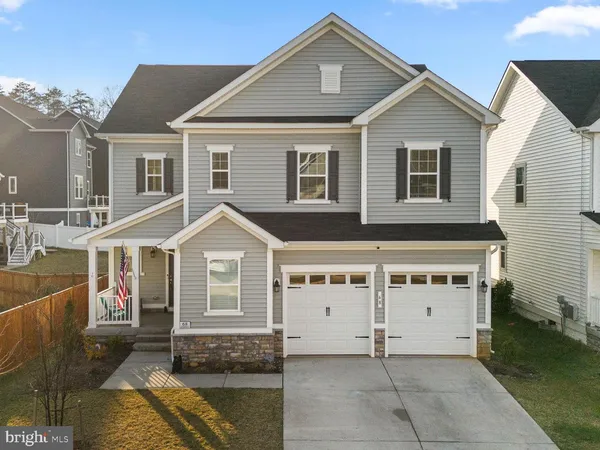 a front view of a house with a garage