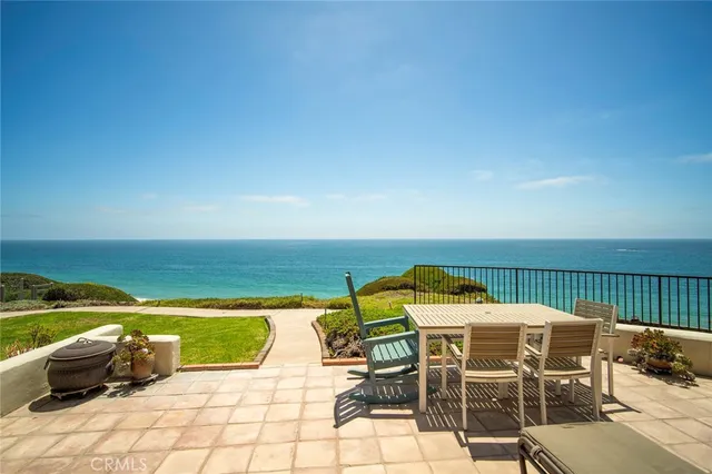 a view of swimming pool with seating area