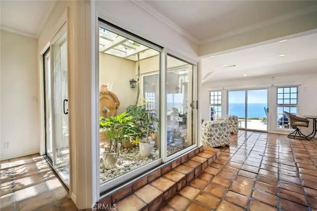 a lobby with furniture and floor to ceiling window