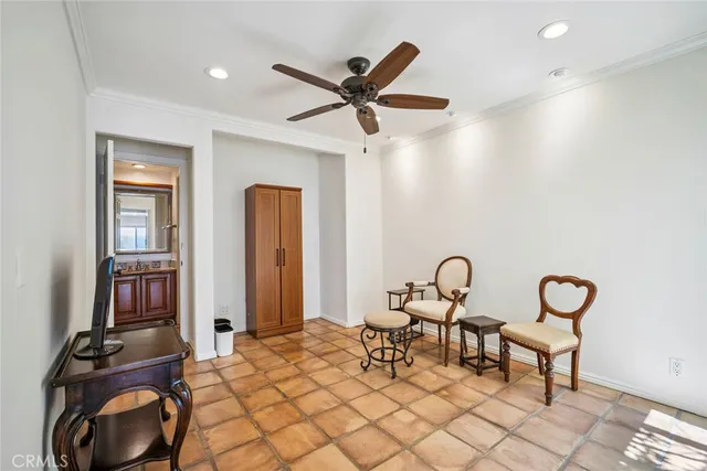 a view of a livingroom with furniture and hallway