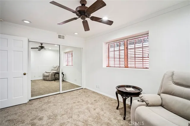 a bathroom with a granite countertop shower sink vanity and a mirror