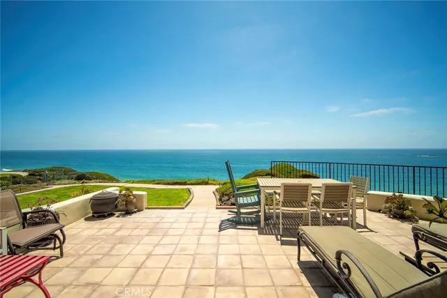 a terrace with outdoor seating and barbeque oven