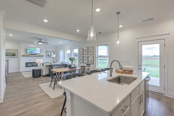 a kitchen with a refrigerator and a sink