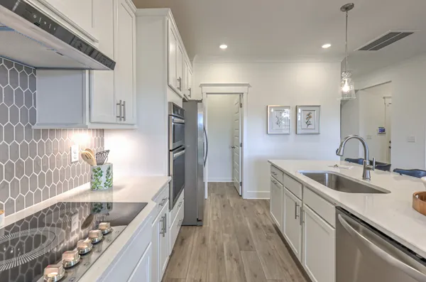 a kitchen with a table and chairs