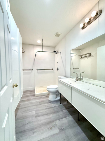 1705 80 East Tooele, UT 84074 - Photo 19 of 22 Contemporary bathroom featuring an expansive floating vanity with an integrated sink and a large mirror