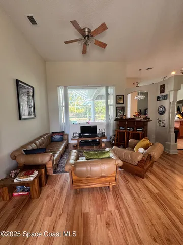 a living room with furniture or couch and a wooden floor