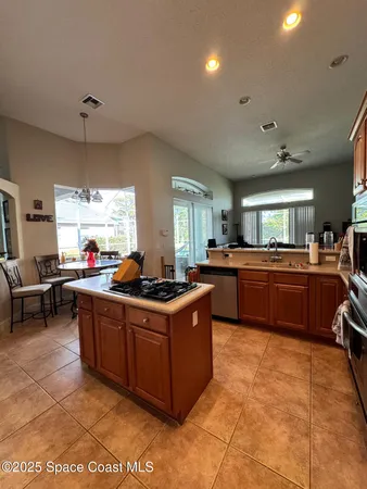 a kitchen with stainless steel appliances stove a sink and a refrigerator