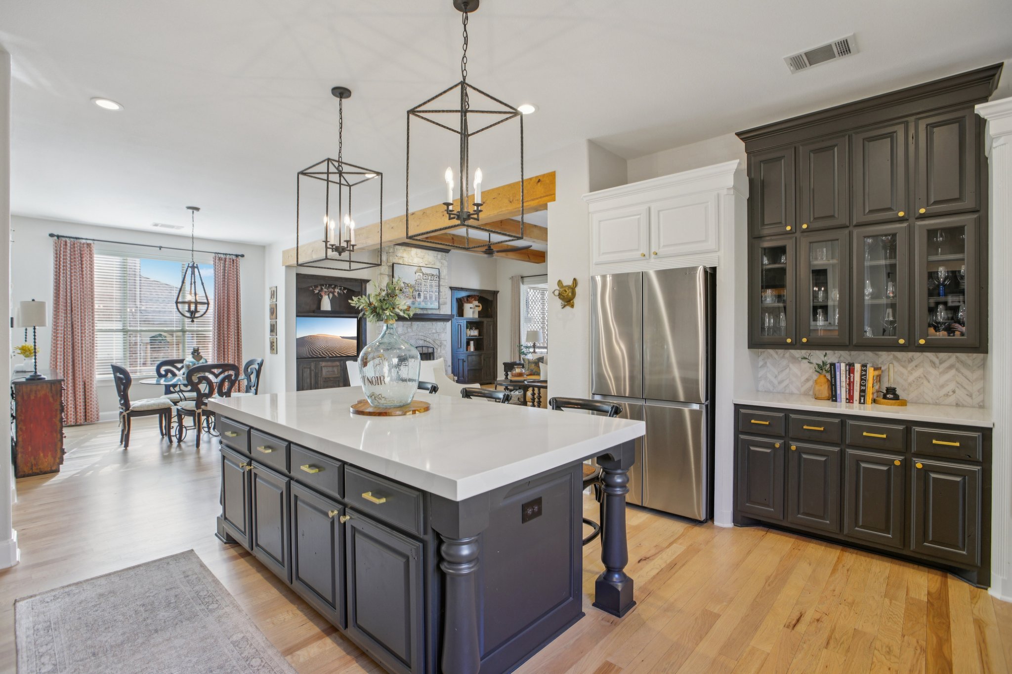 436 SANTALUZ Path Austin, TX 78732 - Photo 11 of 34 The open layout connects the kitchen freely to the living room, ensuring the host is never left out.