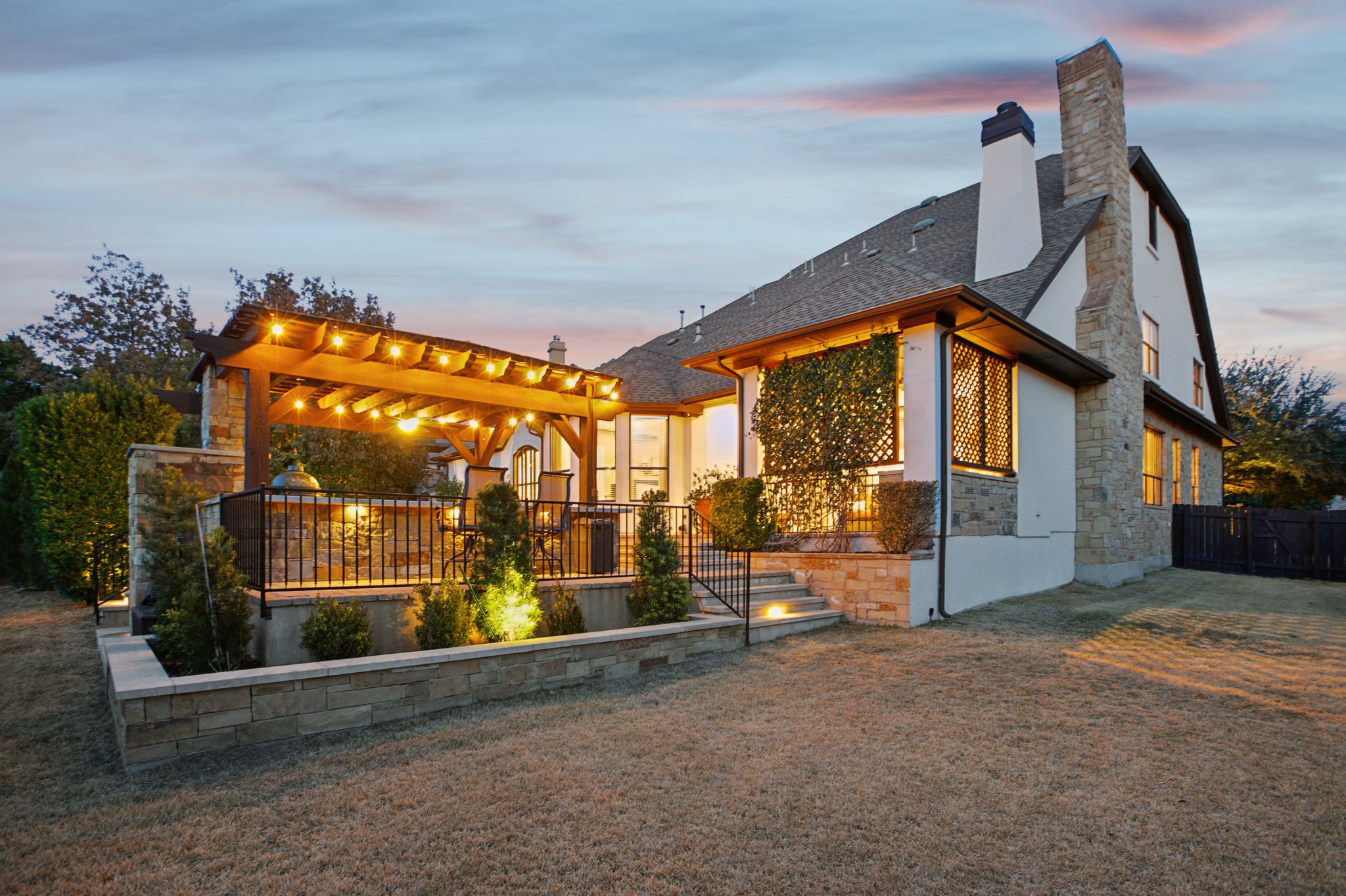 436 SANTALUZ Path Austin, TX 78732 - Photo 25 of 34 Designed for hosting unforgettable gatherings, the backyard is a true private oasis.