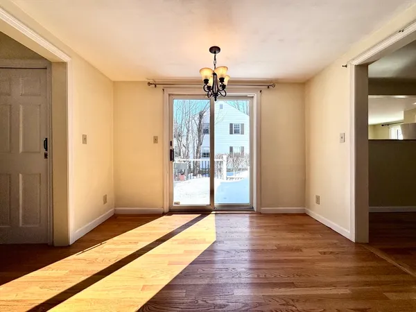 a view of a room with wooden floor and staircase
