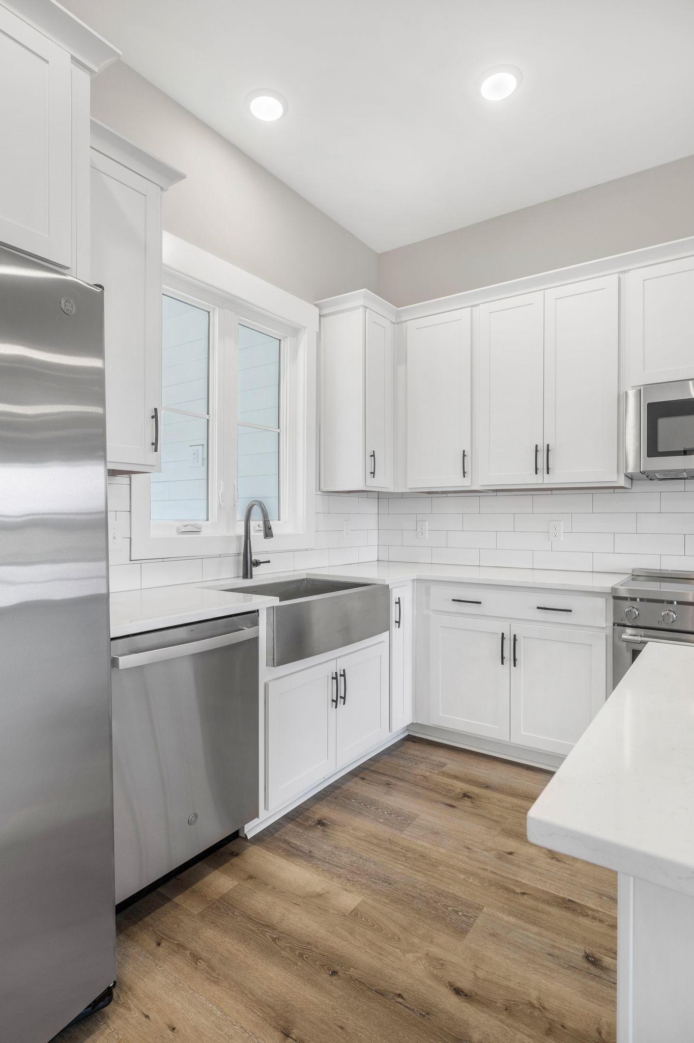 1694 McAfee Road Morrison, TN 37357 - Photo 14 of 41 a kitchen with granite countertop white cabinets and white appliances