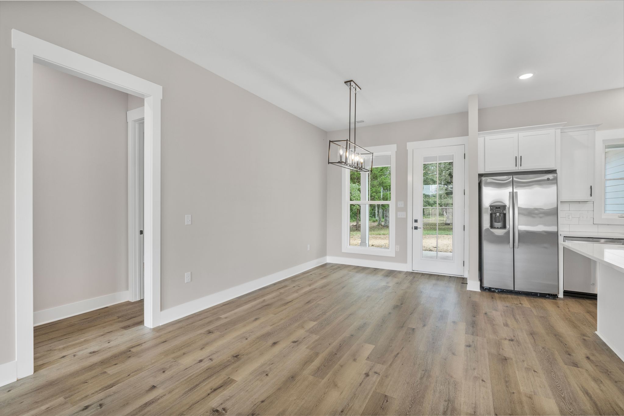 1694 McAfee Road Morrison, TN 37357 - Photo 15 of 41 a view of wooden floor and windows in a room