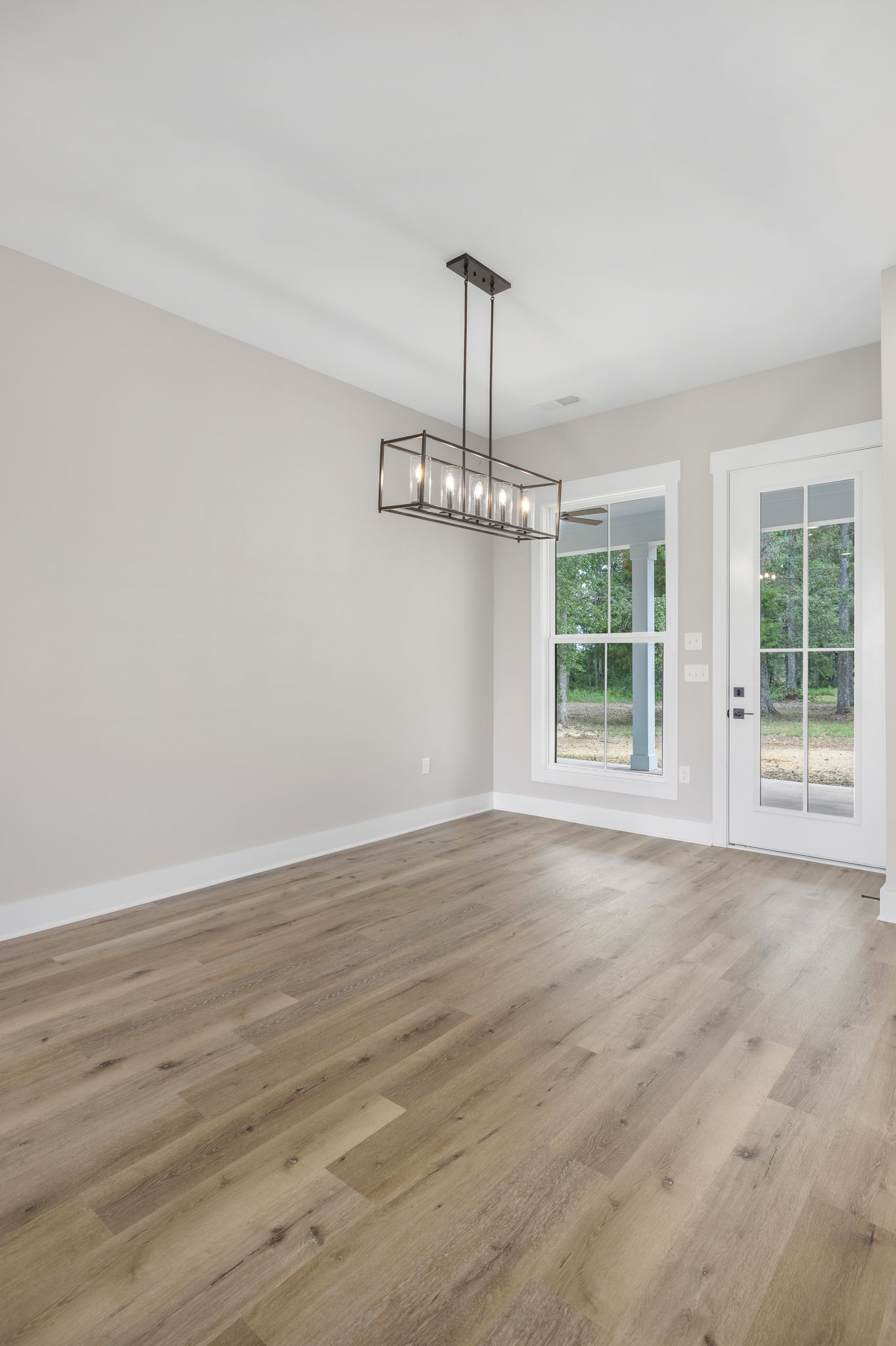 1694 McAfee Road Morrison, TN 37357 - Photo 16 of 41 a view of an empty room with wooden floor and a window