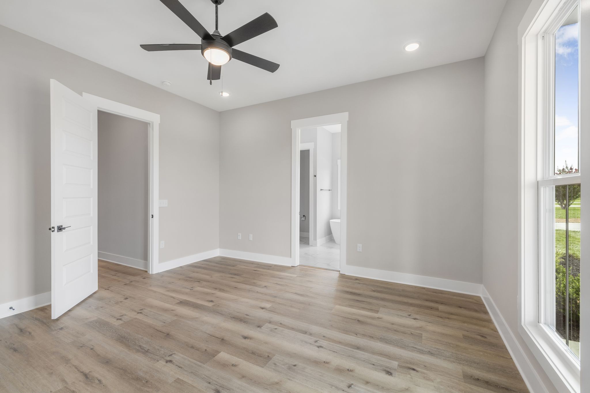 1694 McAfee Road Morrison, TN 37357 - Photo 20 of 41 an empty room with wooden floor and windows