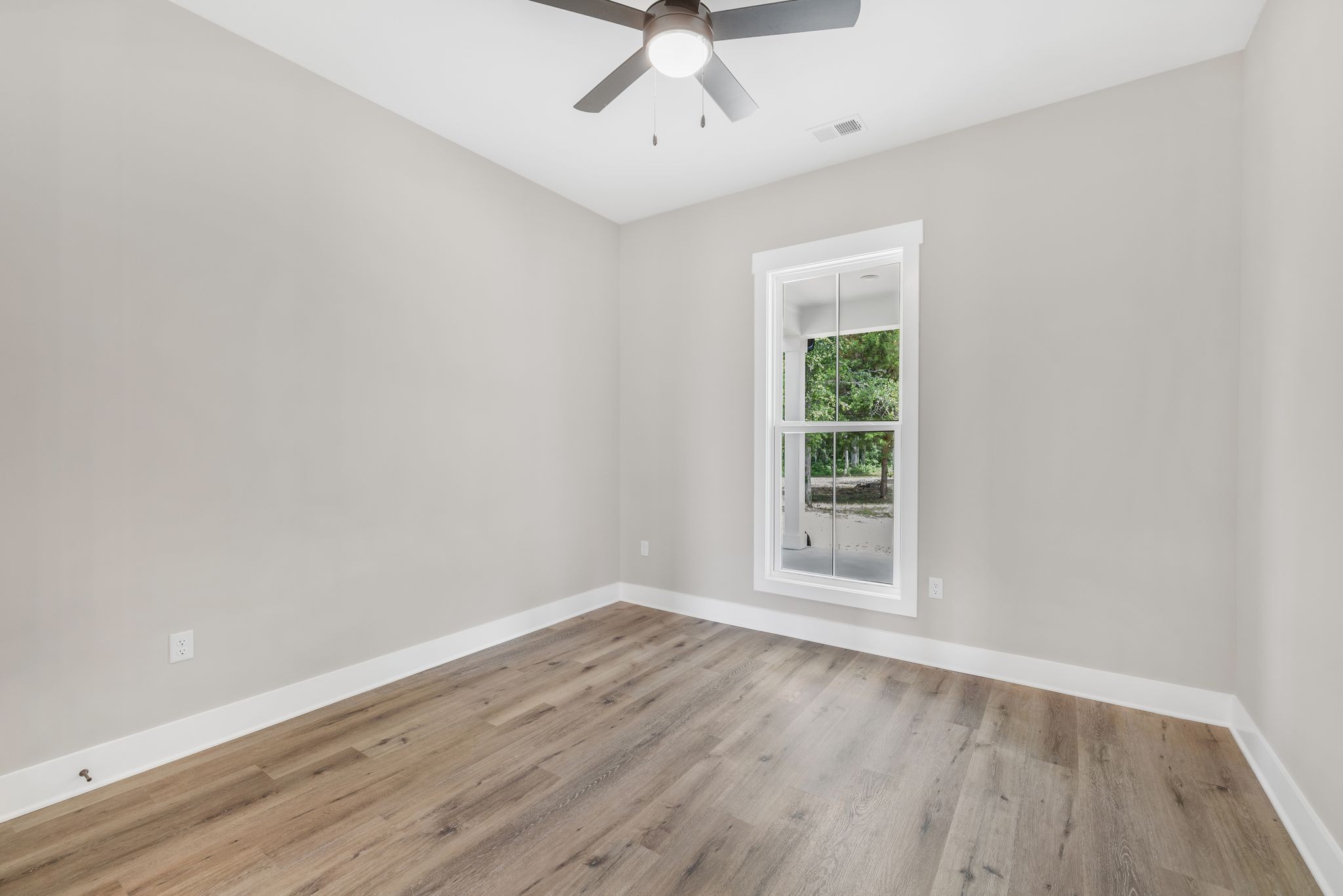 1694 McAfee Road Morrison, TN 37357 - Photo 26 of 41 wooden floor in an empty room with a window