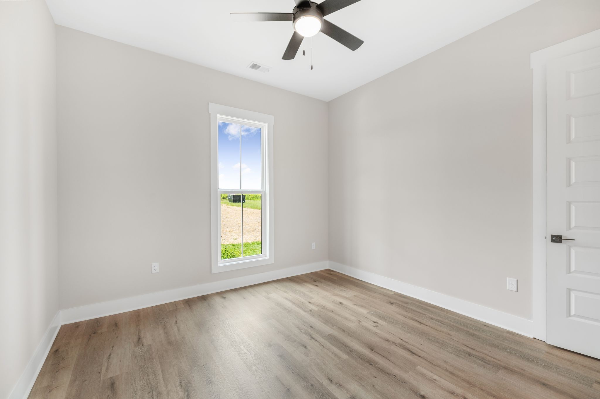 1694 McAfee Road Morrison, TN 37357 - Photo 29 of 41 wooden floor in an empty room with a window